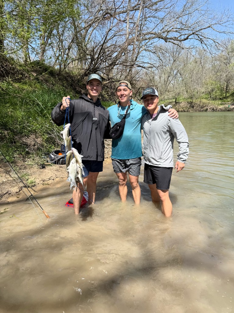 Three friends with a stringer of white bass at The Steps