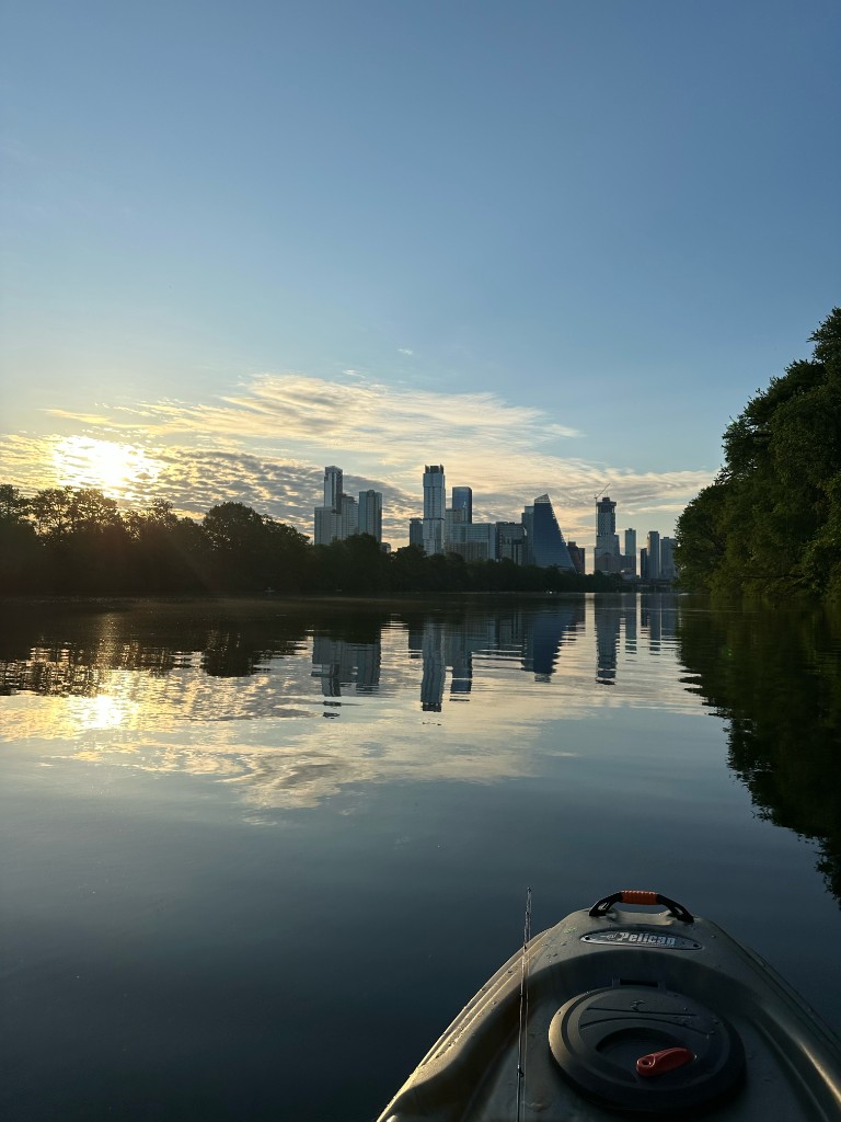 Sunrise over the Austin skyline from a kayak on Town Lake
